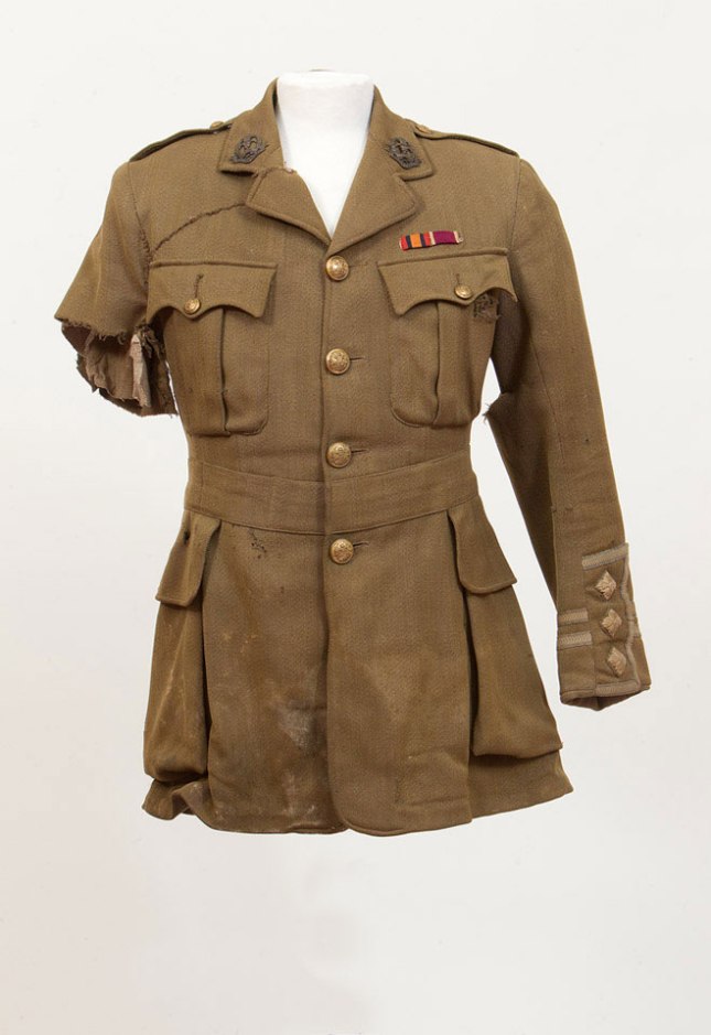Tunic of Captain Johnson, 2nd Middlesex. He was wounded in the hip and arm on 1 July 1916, his tunic clearly shows where it was cut away from his wounds. Image © National Army Museum